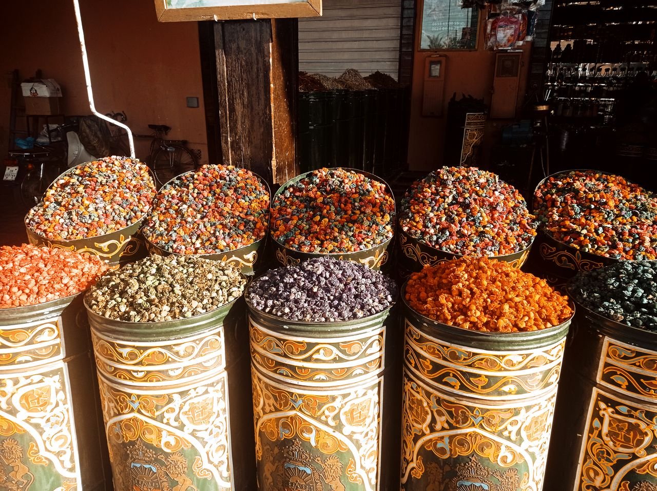 Boswellia Ogadensis: Ethiopian Frankincense, Composition, Origin and Uses Brightly colored dried flowers beautifully arranged in ornate tin containers at a Moroccan market.
